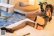 A woman in a black lingerie laying on a bed.